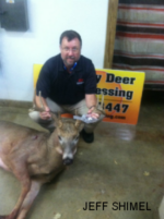 Man holding killed buck