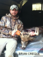 Man holding killed buck
