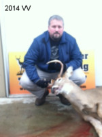 Man holding killed buck