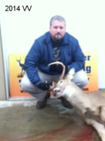 Man holding killed buck