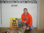 Man holding killed buck