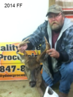 Man holding killed buck