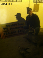 Man holding killed buck