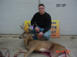Man holding killed buck