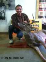 Man holding killed buck