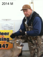 Man holding killed buck