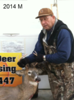 Man holding killed buck