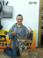 Man holding killed buck