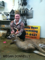 Man holding killed buck