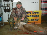 Man holding killed buck