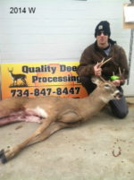 Man holding killed buck