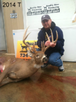 Man holding killed buck