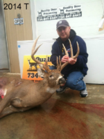 Man holding killed buck