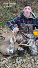Man holding killed buck