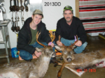 Man holding killed buck