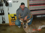 Man holding killed buck