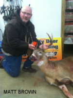 Man holding killed buck