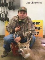 Man holding killed buck