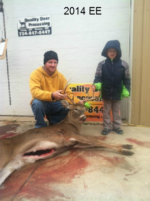 Man holding killed buck