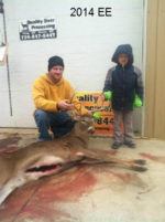 Man holding killed buck