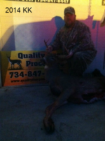 Man holding killed buck
