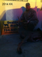 Man holding killed buck