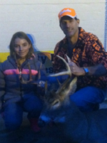 Man holding killed buck