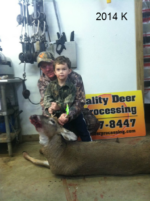 Man holding killed buck
