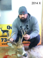 Man holding killed buck