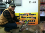 Man holding killed buck
