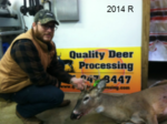 Man holding killed buck