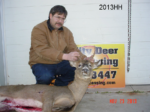 Man holding killed buck