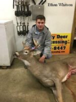 Man holding killed buck
