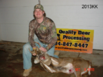 Man holding killed buck