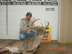 Man holding killed buck