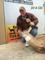 Man holding killed buck