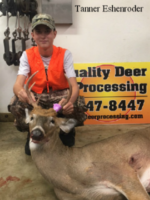 Man holding killed buck