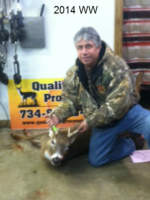 Man holding killed buck