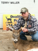 Man holding killed buck