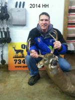 Man holding killed buck