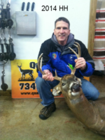 Man holding killed buck