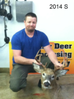 Man holding killed buck