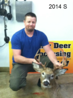 Man holding killed buck