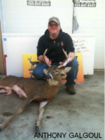 Man holding killed buck