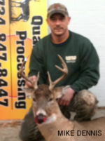 Man holding killed buck