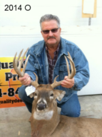 Man holding killed buck