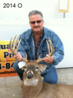 Man holding killed buck