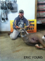 Man holding killed buck