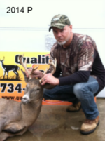 Man holding killed buck