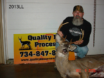 Man holding killed buck